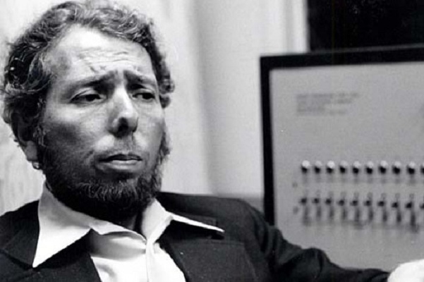 Prof Milgram next to shock machin